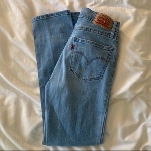Levi’s 724 ripped knee jeans